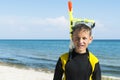 Boy in divingsuit and mask and snorkel at sea background Royalty Free Stock Photo