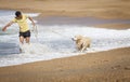 A boy with a dog on the beach