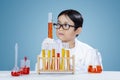 Boy doing chemical research with chemistry fluid