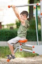 Boy doing fitness outdoor and having fun