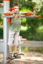 Boy doing fitness outdoor and having fun