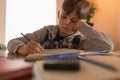 Boy doing his homework at home Royalty Free Stock Photo