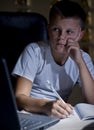 Boy doing homework with laptop Royalty Free Stock Photo