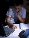 Boy doing homework with laptop Royalty Free Stock Photo