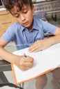 BOY WORKS AT HOME DURING CONTAINMENT PERIOD Royalty Free Stock Photo