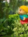 The Boy Doll Hold a Happy Sign Hanging a Plant Royalty Free Stock Photo