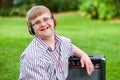 Boy with down syndrome wearing headphones.