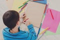 Boy drawing picture with colored pencils and Royalty Free Stock Photo