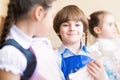 Boy draws in class with other children Royalty Free Stock Photo