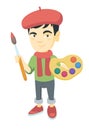 Boy dressed as an artist holding brush and paints. Royalty Free Stock Photo