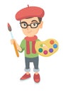 Boy dressed as an artist holding brush and paints. Royalty Free Stock Photo