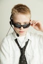 Boy Dressed as Slick Businessman with Head Set Royalty Free Stock Photo