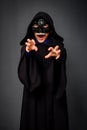 A child in a Halloween costume makes threatening gestures Royalty Free Stock Photo