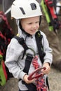 Boy dressed in mountaineering equipment