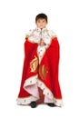 Boy dressed in a robe of King. Isolated Royalty Free Stock Photo