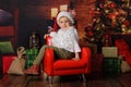 Boy dressed in Santa Claus`s Christmas