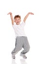 Boy, dressed in white T-shirt, dancing Royalty Free Stock Photo