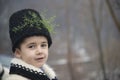 Boy dressed in winter traditional Romanian clothes