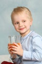 Boy drinking carrot juice