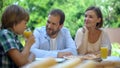 Boy drinking glass of fresh orange juice, sugar-free organic drink for children Royalty Free Stock Photo