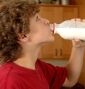 Boy drinking milk from bottle Royalty Free Stock Photo