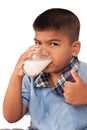 Boy drinking milk and concede Royalty Free Stock Photo