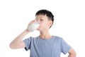 Boy drinking milk over white background