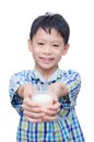 Boy drinking milk over white