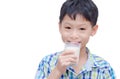 Boy drinking milk over white