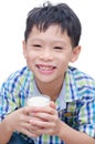 Boy drinking milk over white