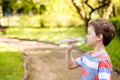 Boy drinking mineral water from the plastic bottle Royalty Free Stock Photo