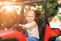 Boy drive electric mini park in park Royalty Free Stock Photo