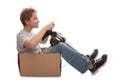 Boy-driver of a cardboard box Royalty Free Stock Photo