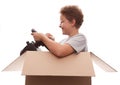 Boy-driver of a cardboard box Royalty Free Stock Photo
