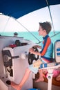 Boy driving catamaran Royalty Free Stock Photo