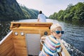 Boy driving motor boat Royalty Free Stock Photo