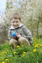 Boy with eastre egg among spring garden Royalty Free Stock Photo