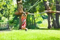 Boy at easy low zip line for kids, adventure park Royalty Free Stock Photo