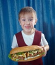Boy eating big sandwiches Royalty Free Stock Photo