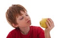 Boy eating a green apple Royalty Free Stock Photo