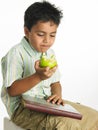 Boy eating a green apple Royalty Free Stock Photo