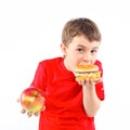 Boy eating a hamburger.