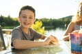 Boy eating hamburger outside with his family Royalty Free Stock Photo