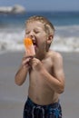 Boy eating ice lolly Royalty Free Stock Photo