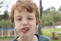 Boy eating meatballs with mouth full