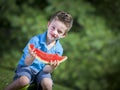 Boy eating melon