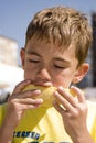 Boy eating melon