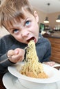 Boy eating nuggets with pasta Royalty Free Stock Photo