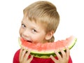 Boy eating a piece of watermelon Royalty Free Stock Photo
