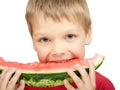 Boy eating a piece of watermelon Royalty Free Stock Photo